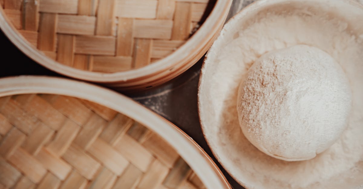 Why is rock sugar used in Chinese cooking? - White Round Ceramic Bowl on Brown Wooden Table