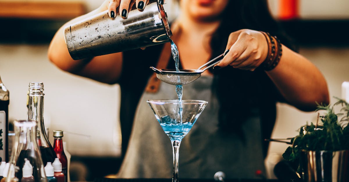 Why is Rum not affected by distillation like Vodka is? - Photo of Woman Pouring Liquid From Drink Mixer