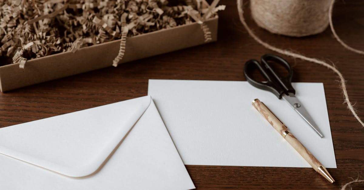 Why is there a sheet of paper in packages of minced meat? - Envelope and pen placed on table near tying twine