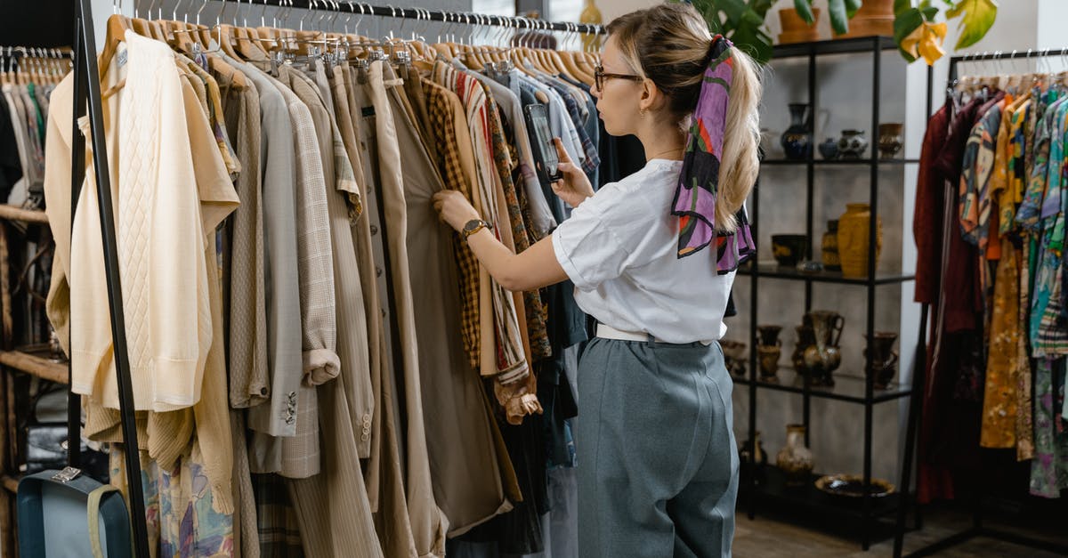 Why isn't my stock consistent - Woman Choosing Clothes in the Shop