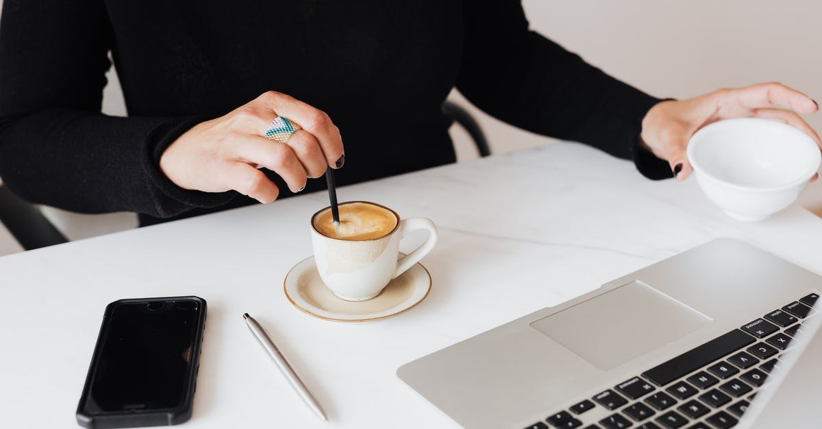 Why not stir the french press using a metal spoon? - Crop unrecognizable female in black clothes working on modern netbook and stirring cup of fresh aromatic espresso