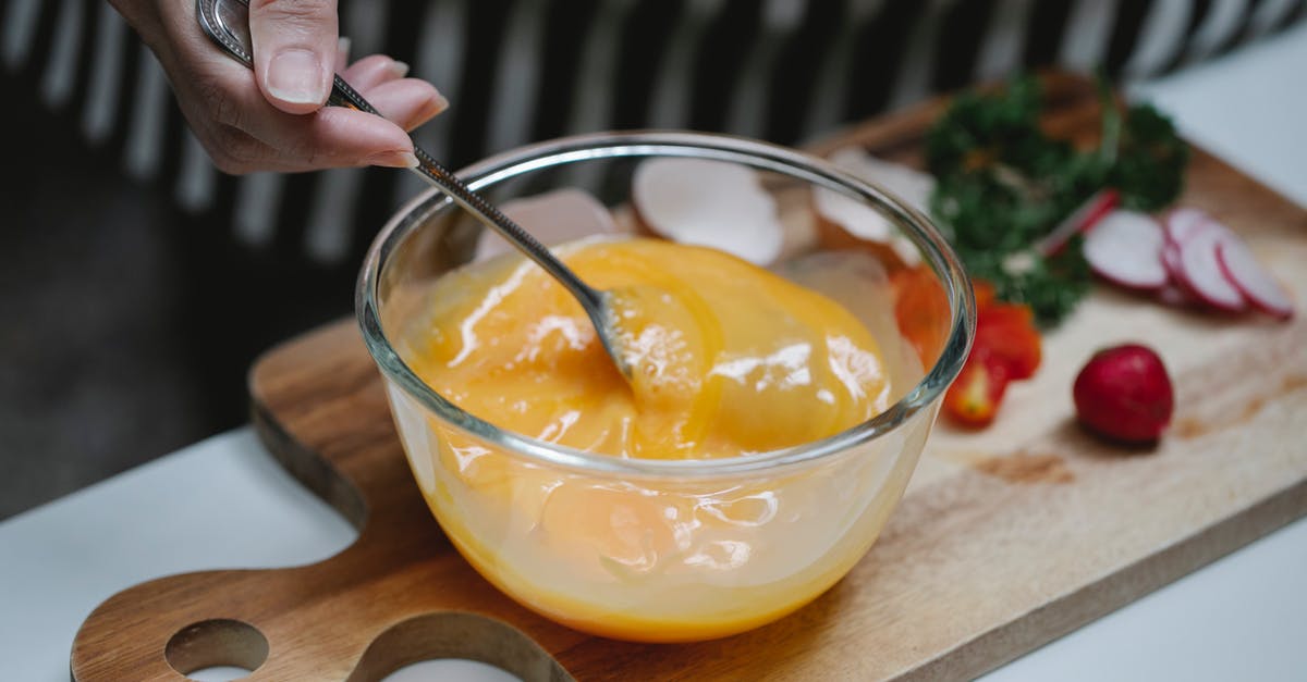 Why or why not beat an egg before adding? - Woman mixing ingredients for breakfast in kitchen