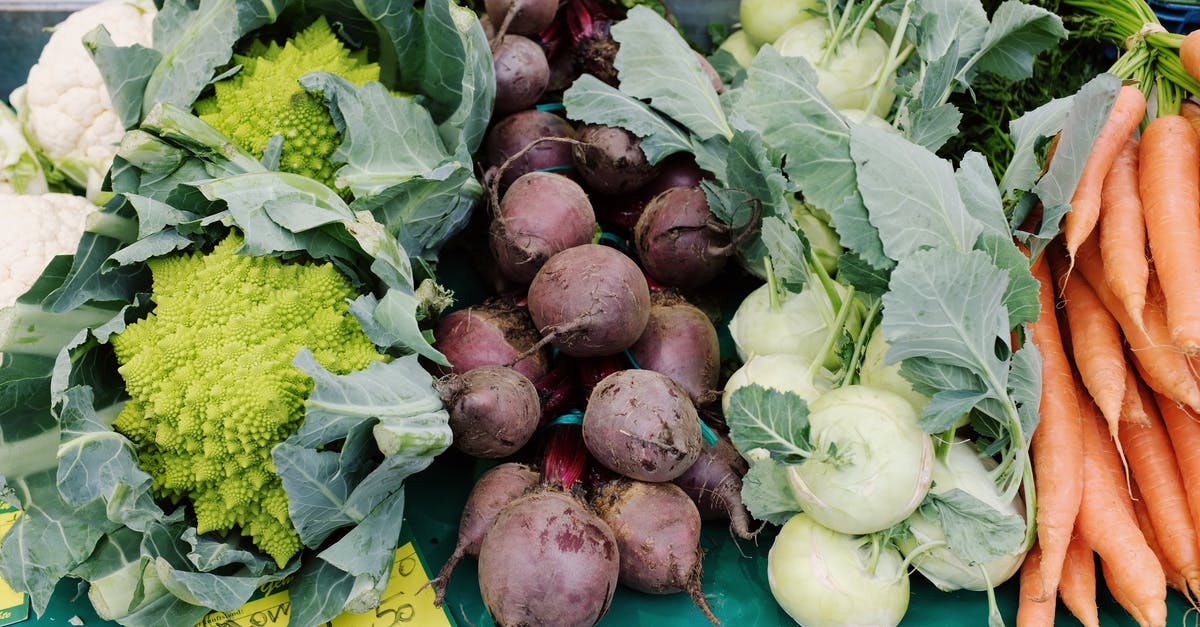 Why remove the vegetables from vegetable stock? [duplicate] - From above set of fresh colorful vegetables placed on table with price tag in grocery market at daytime