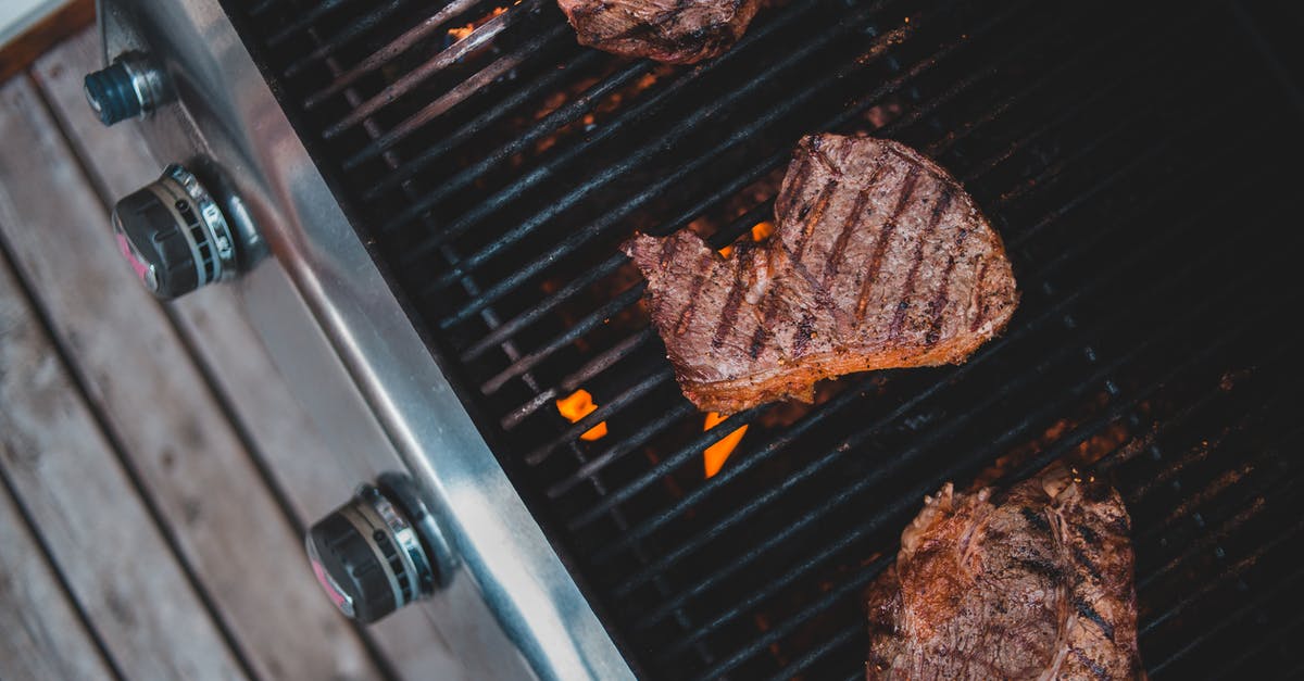 Why season the meat "liberally"? - Meat frying on grill in yard