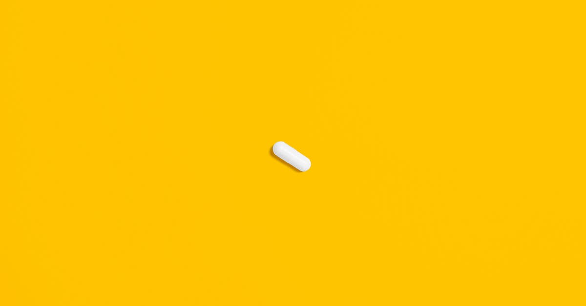 Why should one pre-heat an oven? - White Pill on Yellow Surface