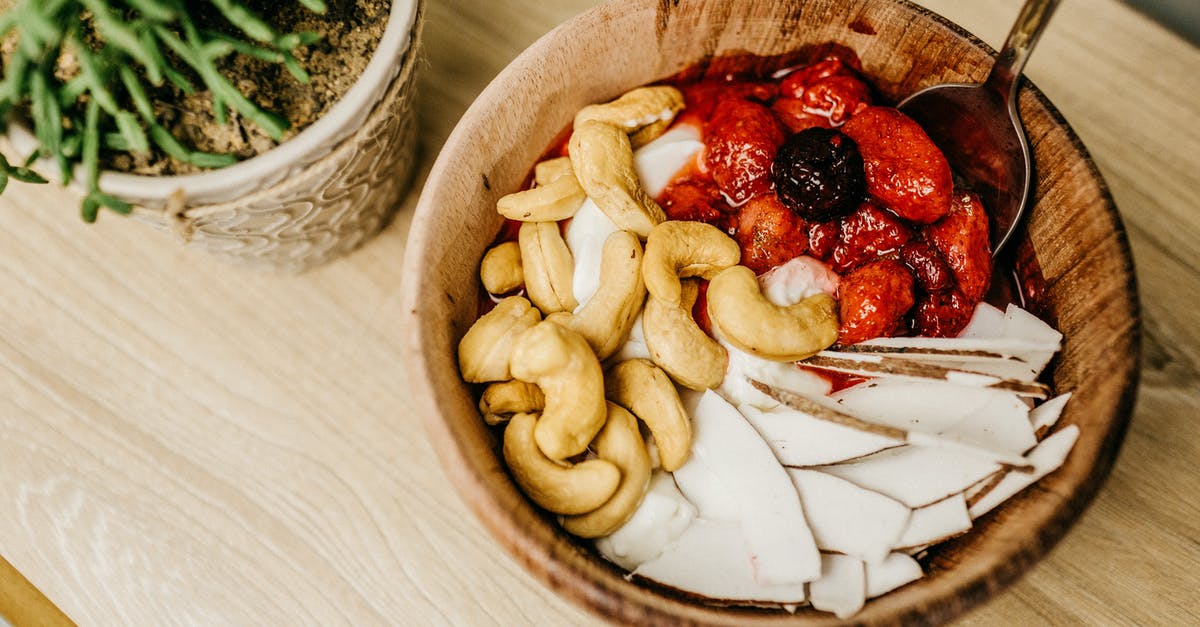 Why some fruits are less common for making jam? - Sliced Strawberries on Brown Wooden Bowl