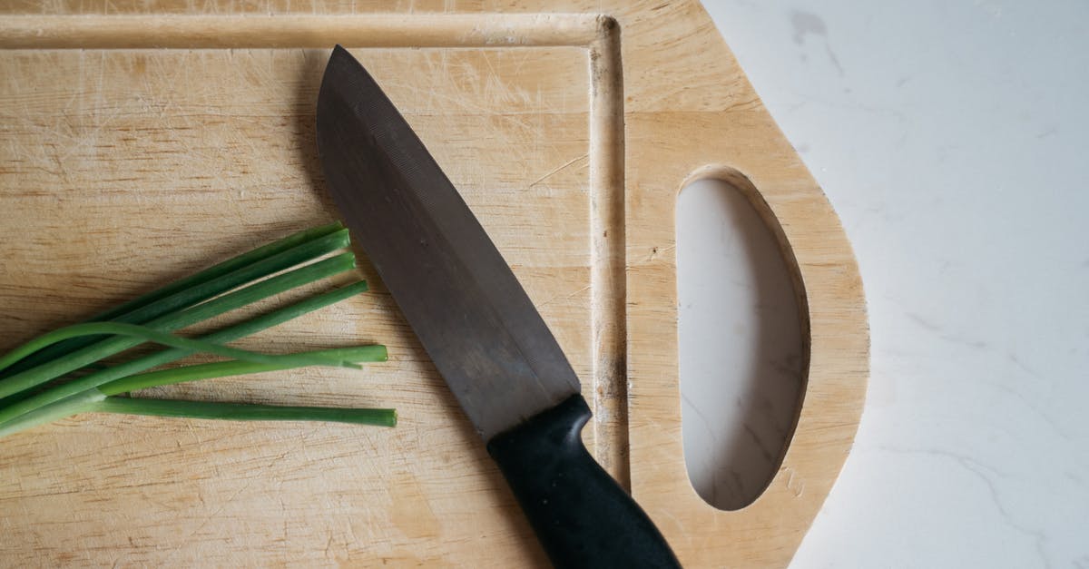 Why stud an onion? - Black Handled Knife on Brown Wooden Chopping Board