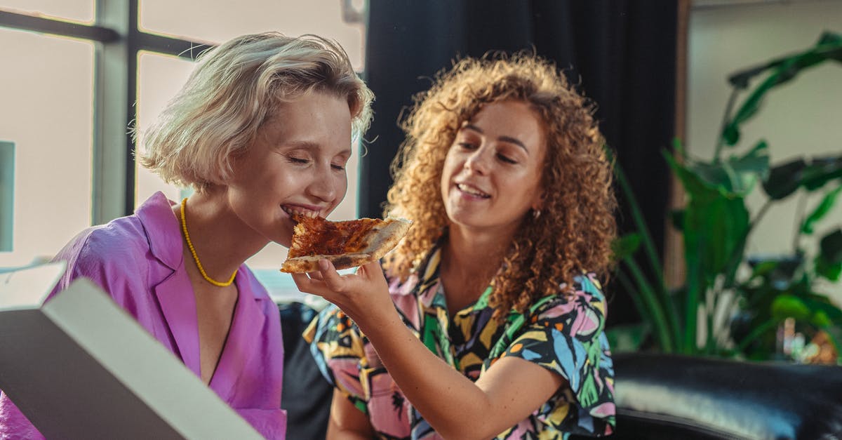 Why the pizza is able to "recover" so quickly? - 2 Women Eating Pizza