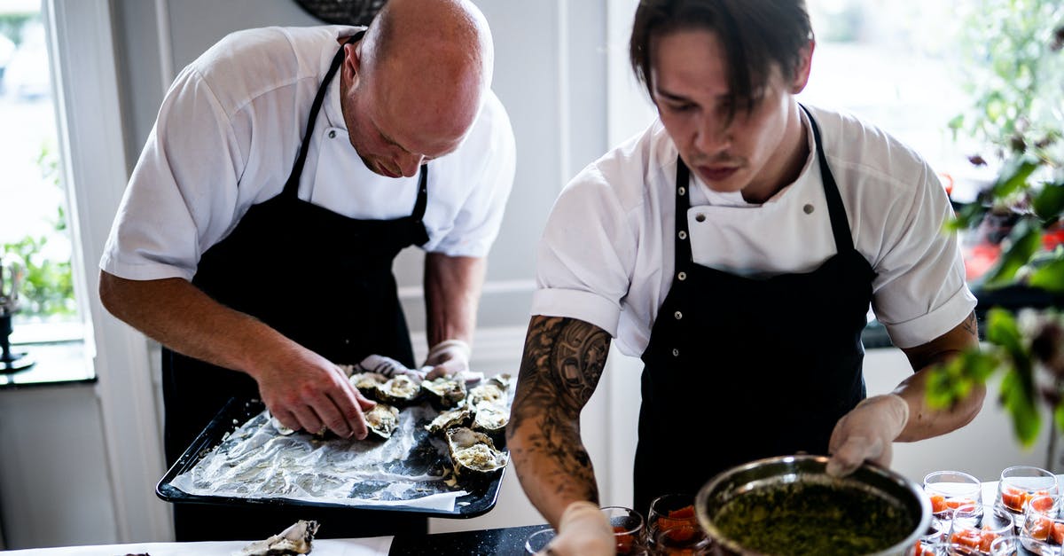 Why use gloves when handling food? - Two Men Preparing Food