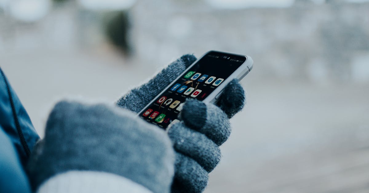 Why use gloves when handling food? - Person Wearing Gloves Holding a Cellphone