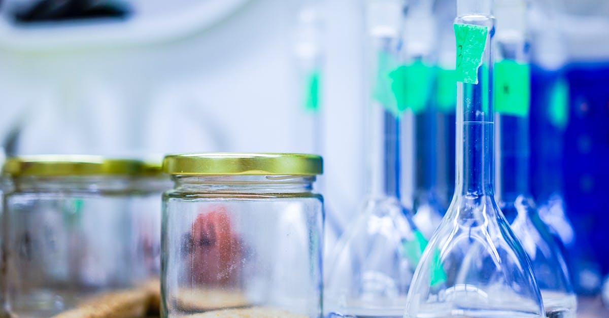 Will a dishwasher sterilize bottles for canning? - Two Clear Glass Jars Beside Several Flasks