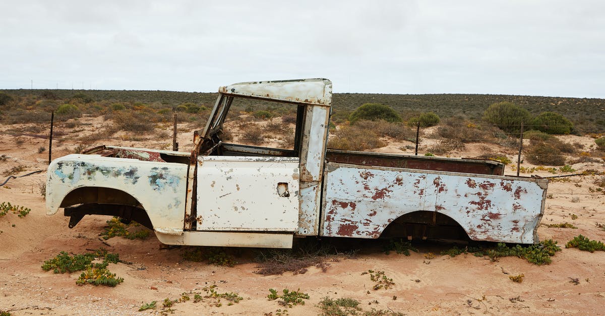 Will a metal dough scraper damage a granite countertop? - Rusty abandoned car near fence in desert