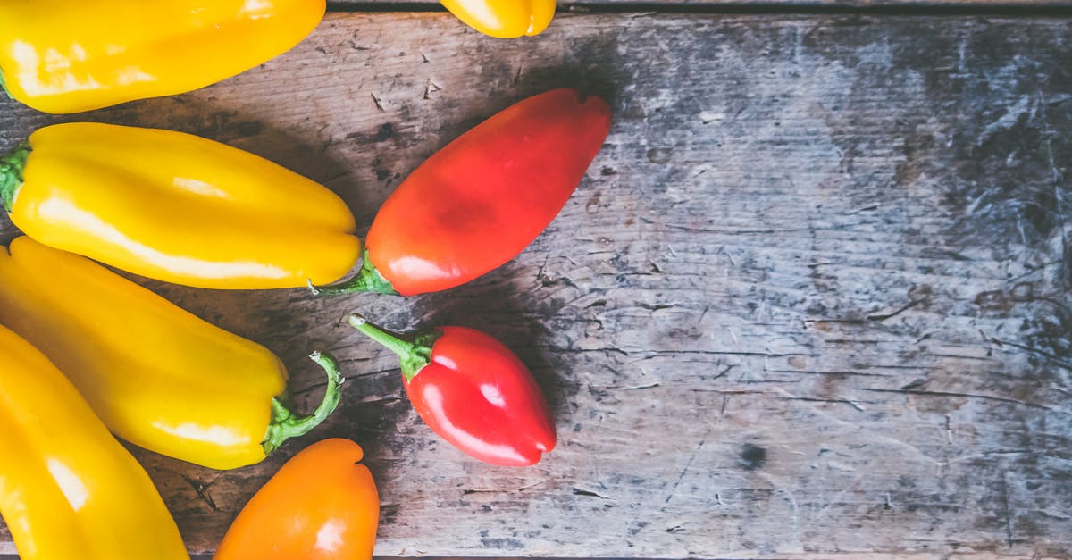 Will fresh bell peppers give stew a red colour? - Yellow, Orange, and Red Peppers on Wooden Surface