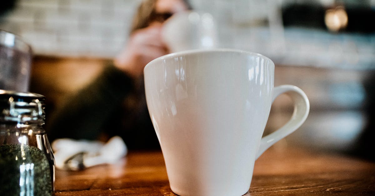 Will ground sealed pepper have lost it freshness? - Cup of coffee against anonymous person in cafe