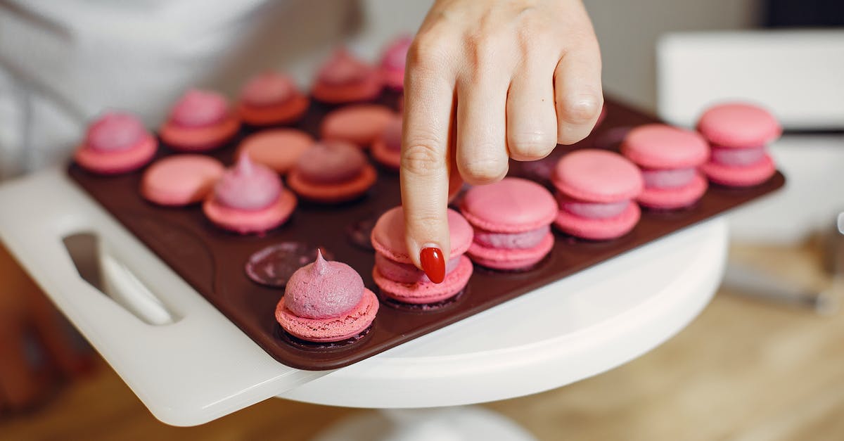 Will lowfat cream cheese keep filling from setting? - Woman placing shells of macaroons on top