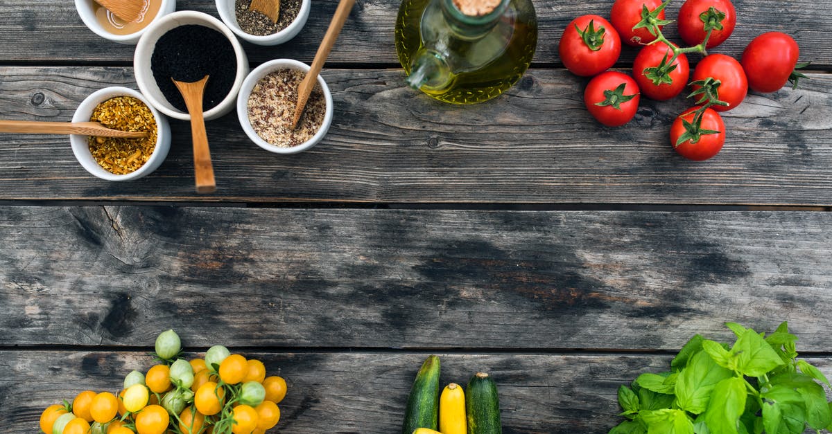 Will seasoning cast iron skillet with vegetable oil leave trans fats? - Fresh ingredients for salad placed on wooden table