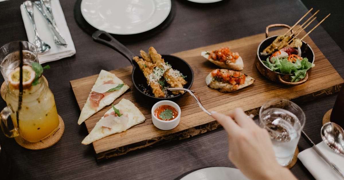 Wine reduction sauce a little too rich - Crop woman eating delicious diverse meal in restaurant