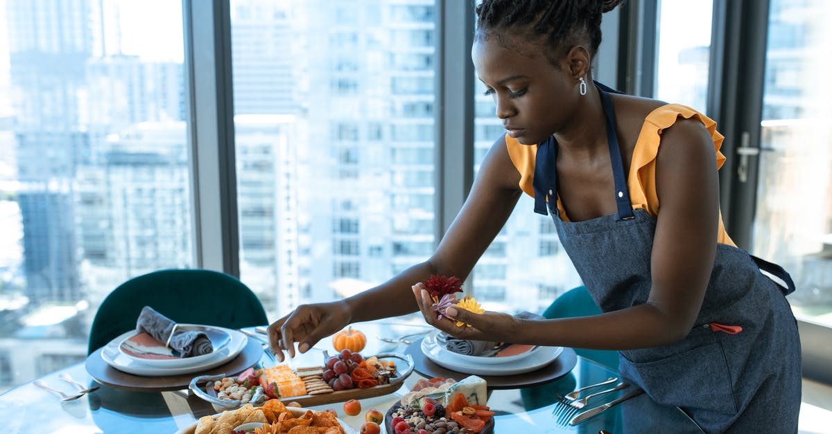 Wine substitutions for homemade salami - Woman in Blue Tank Top Eating on Table