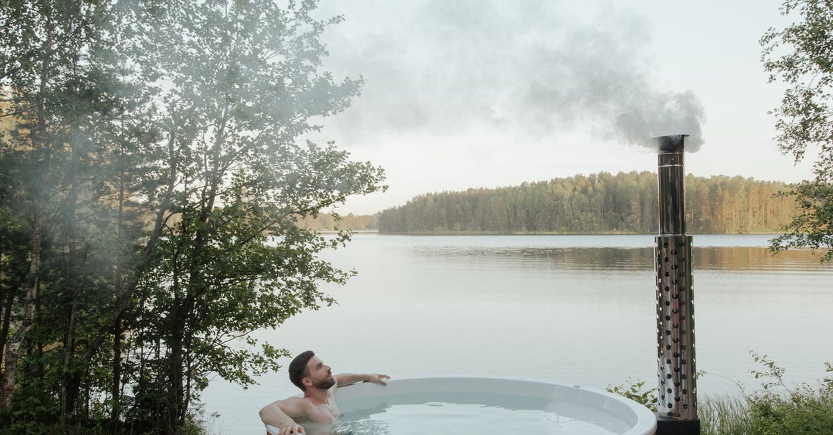 Wood pellets in a smoke box: - Man and Woman in White and Brown Inflatable Pool