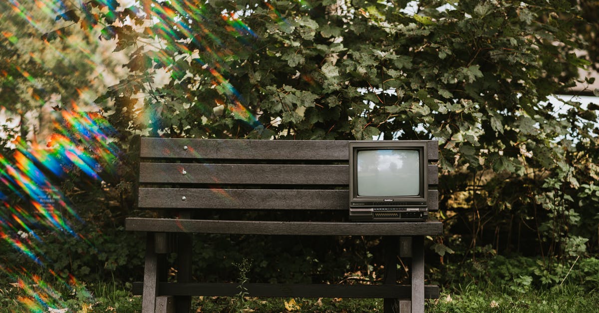 Wooden cutting board turns black - Vintage TV set on wooden bench