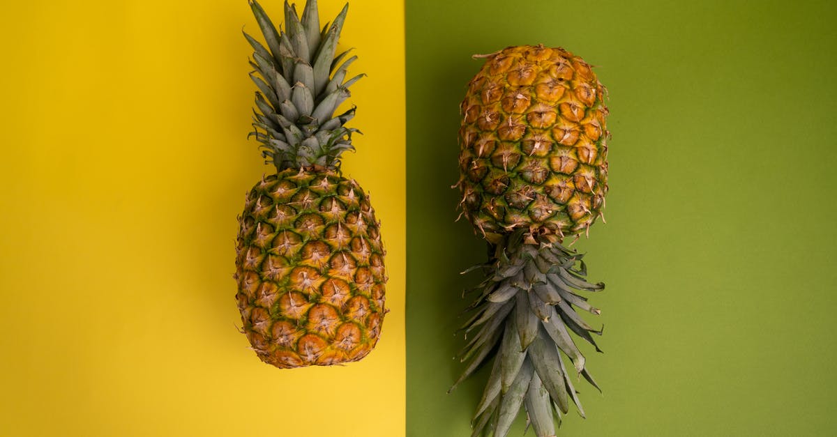 Would freezing a whole pineapple change it visually? - Arrangement of ripe pineapples in studio