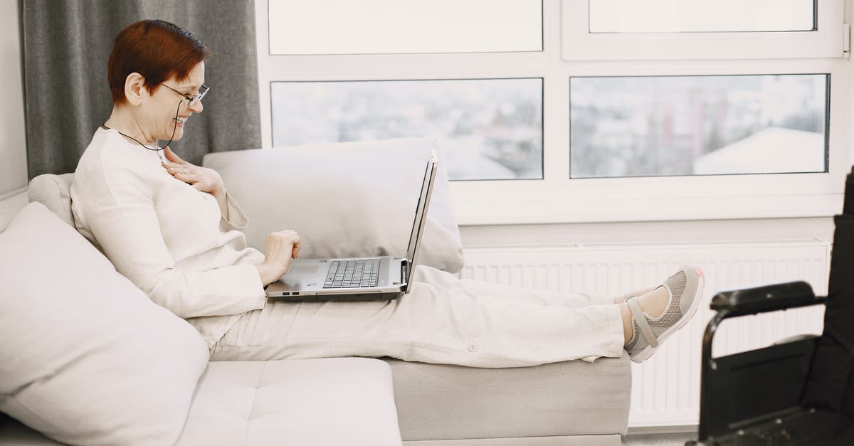 Would this be called matured cream? - A Mature Woman Sitting on Sofa Using a Laptop