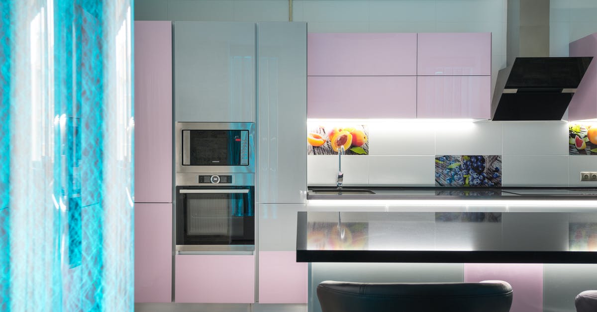 Yorkshire puddings in a fan assisted oven - Interior of modern kitchen with contemporary appliances