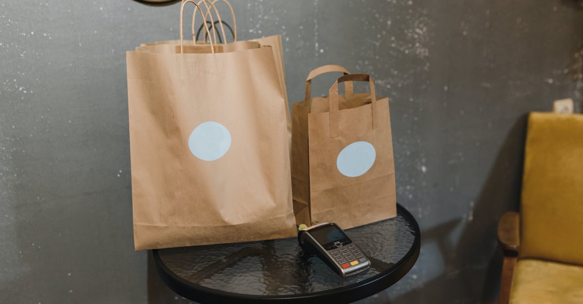 Ziploc vacuumed bags expand in sous vide - Brown Paper Bag on Round Black Table